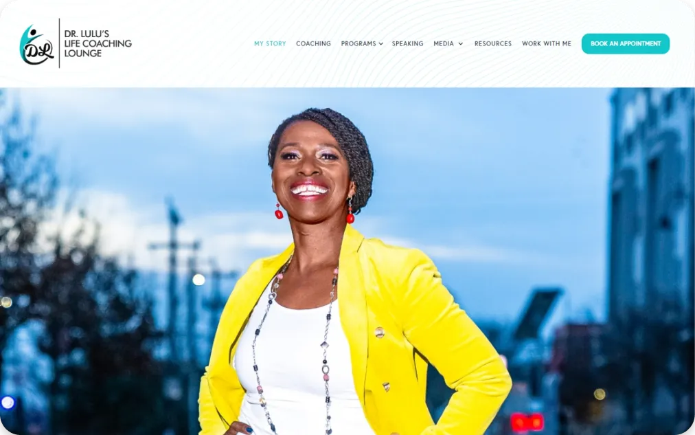 Smiling woman wearing a bright yellow blazer.